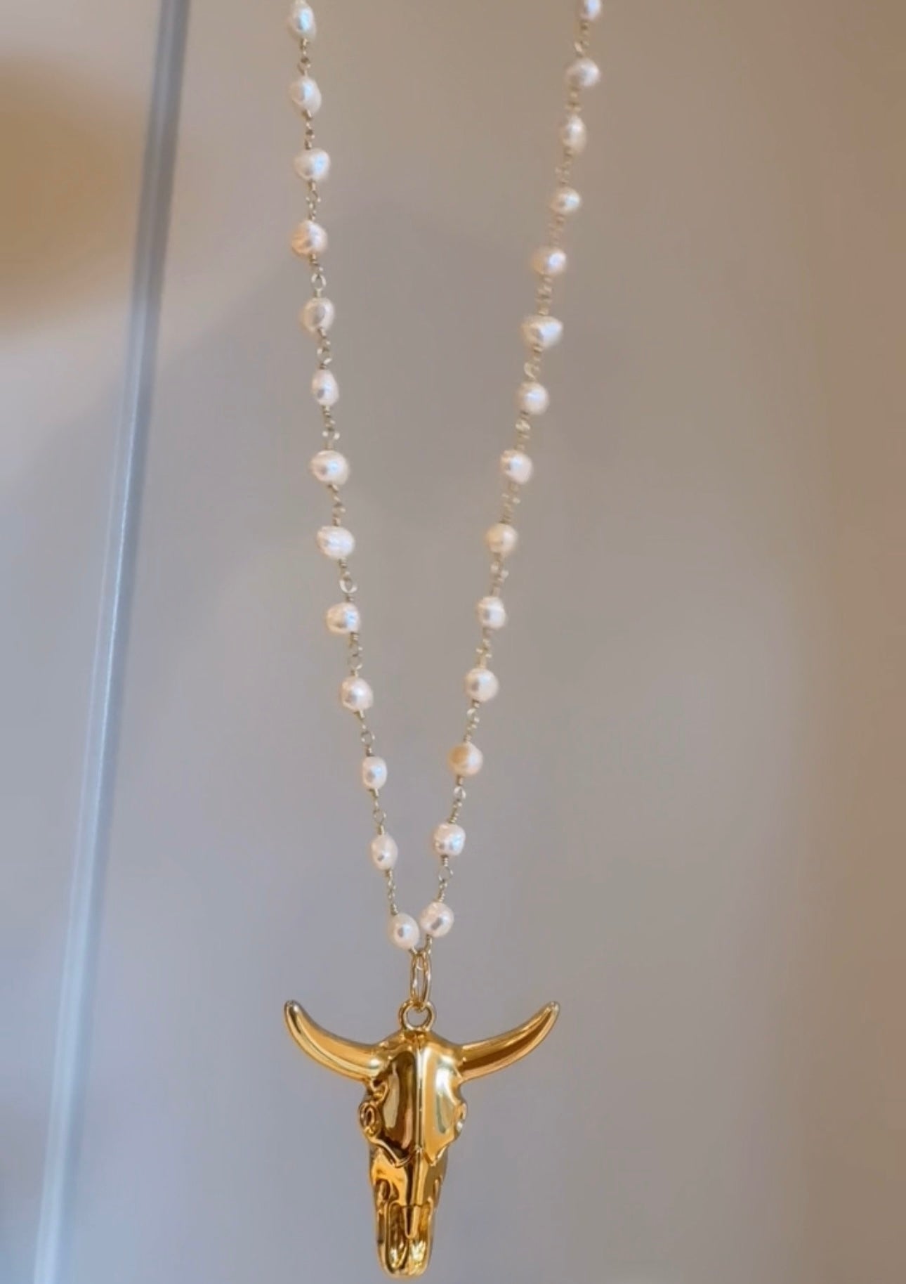 Bull pendant on pearl chain or paperclip chain