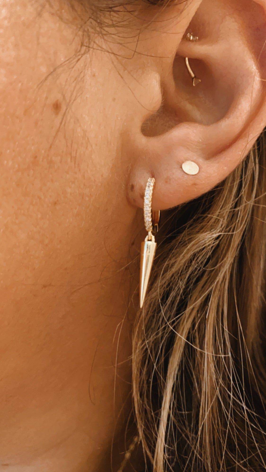 Gold spike earrings with czs, gold buggies with spike